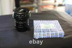 Nikon PC-Nikkor 28mm f/3.5 tilt-shift lens with lens hood