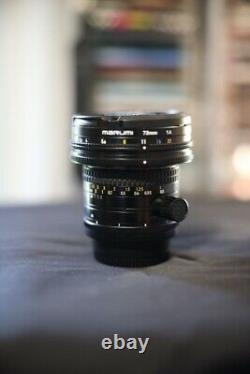 Nikon PC-Nikkor 28mm f/3.5 tilt-shift lens with lens hood