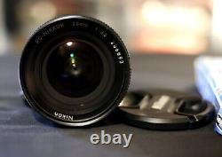 Nikon PC-Nikkor 28mm f/3.5 tilt-shift lens with lens hood